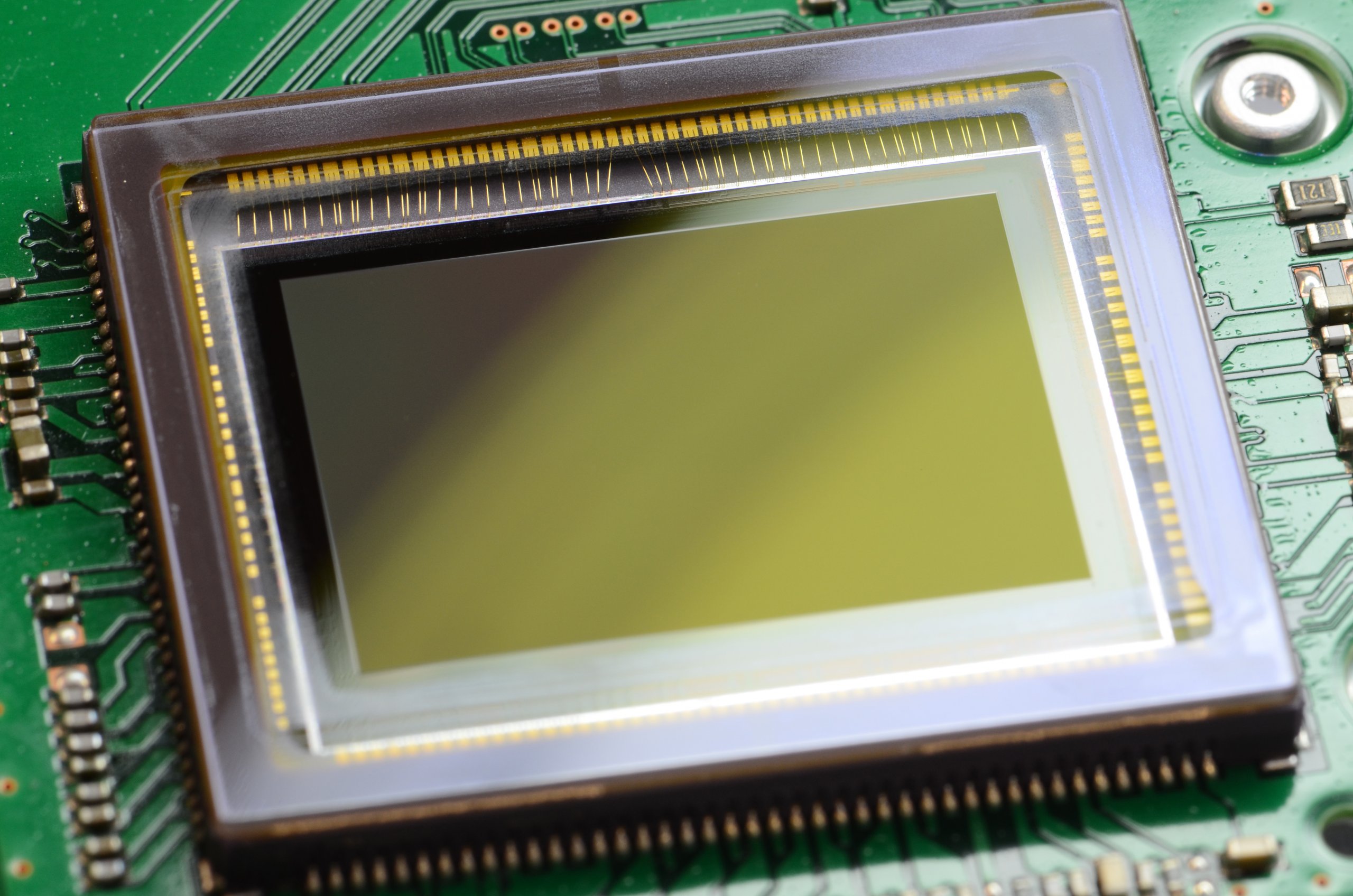 An image sensor for a digital camera, fitted into a circuit board.