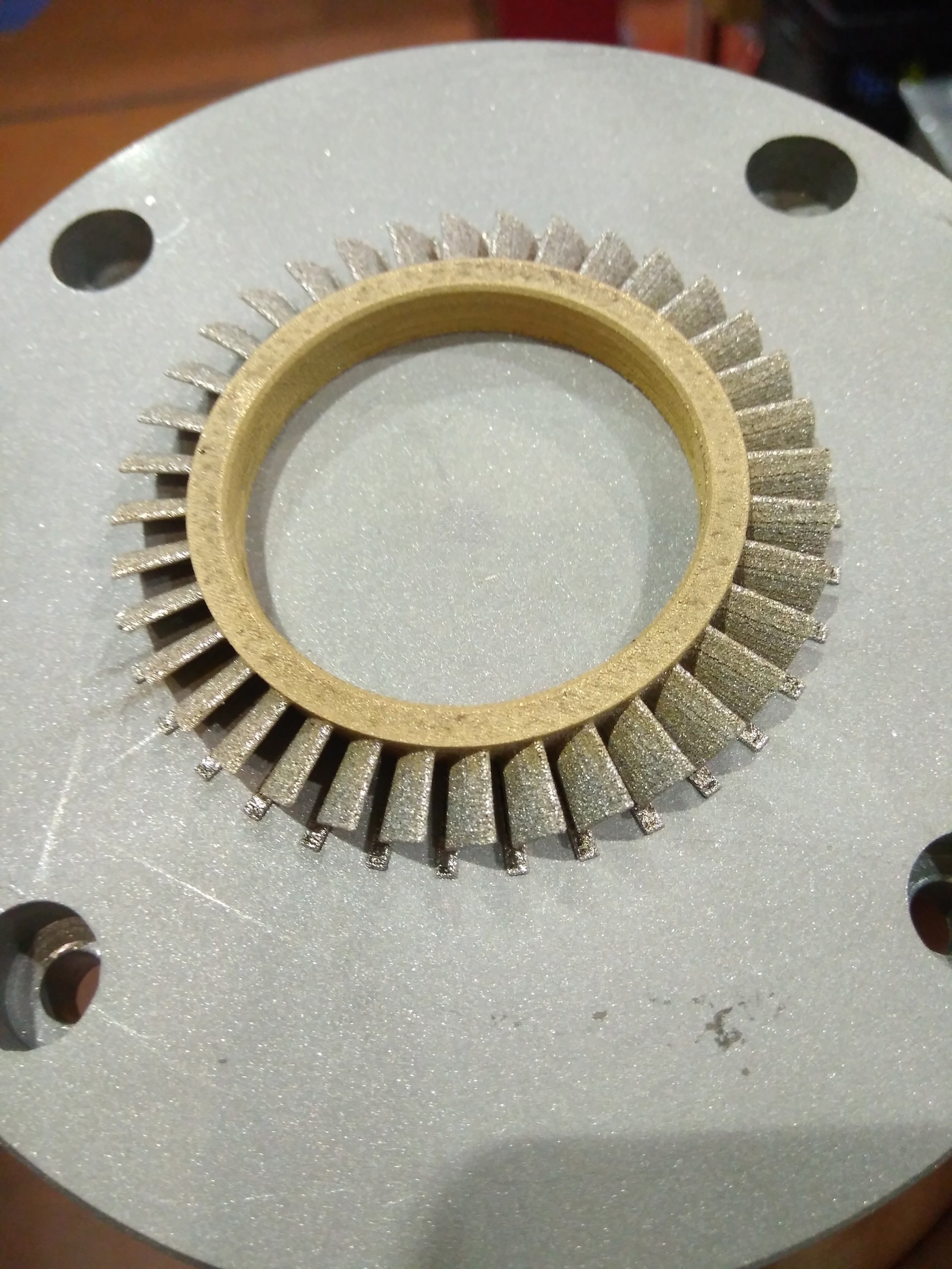 A 10mm turbine disk 3D printed at The University of Manchester.