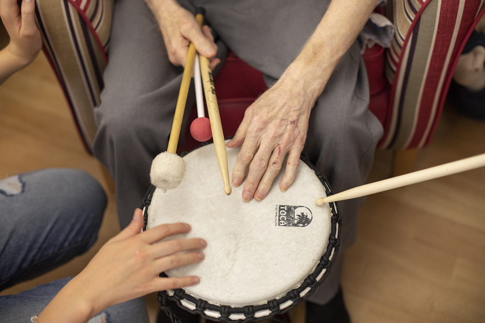 Two hands placed on a drum.