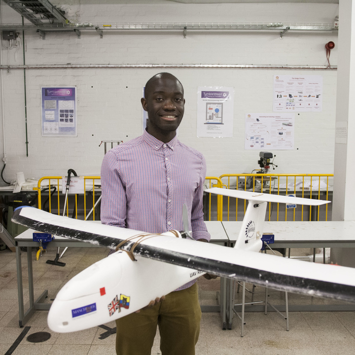 Man with aeroplane model