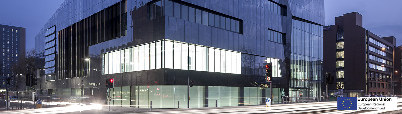 photo of modern building at night (National Graphene Institute)